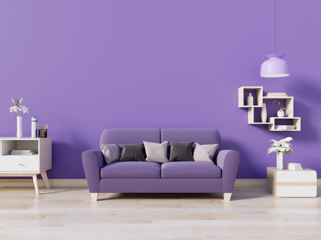 Purple couch with purple wall