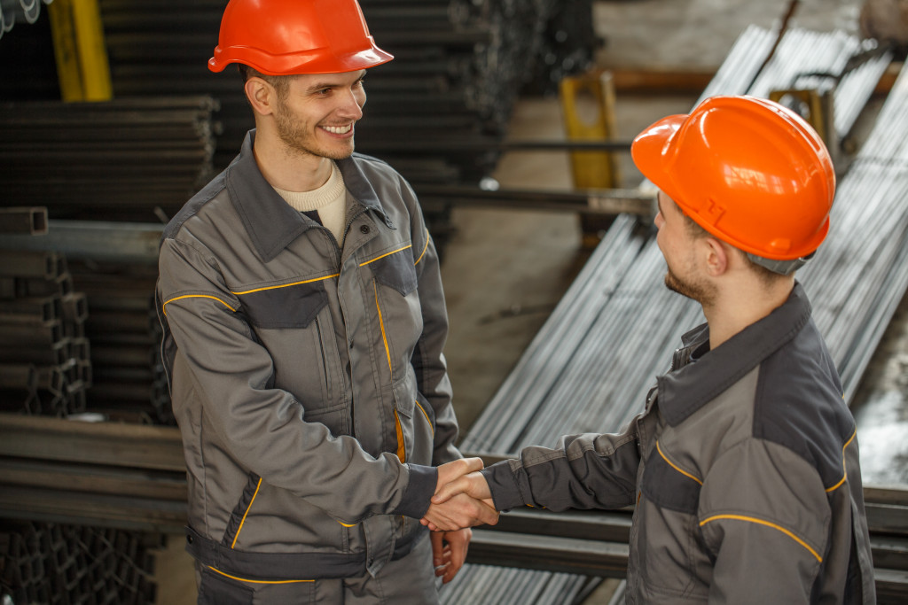 metal factory workers talking